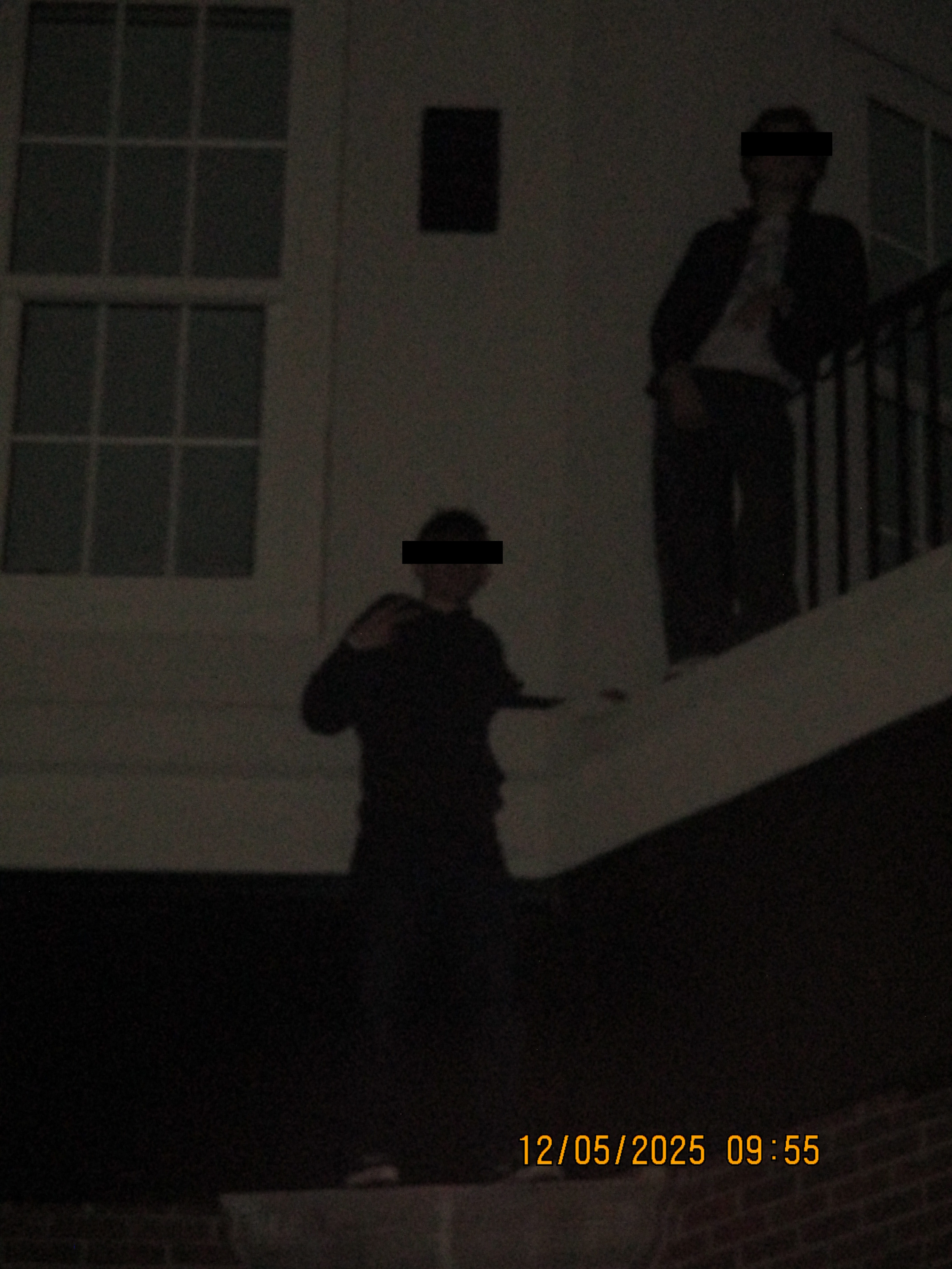 A friend and I on the side of a building we climbed.